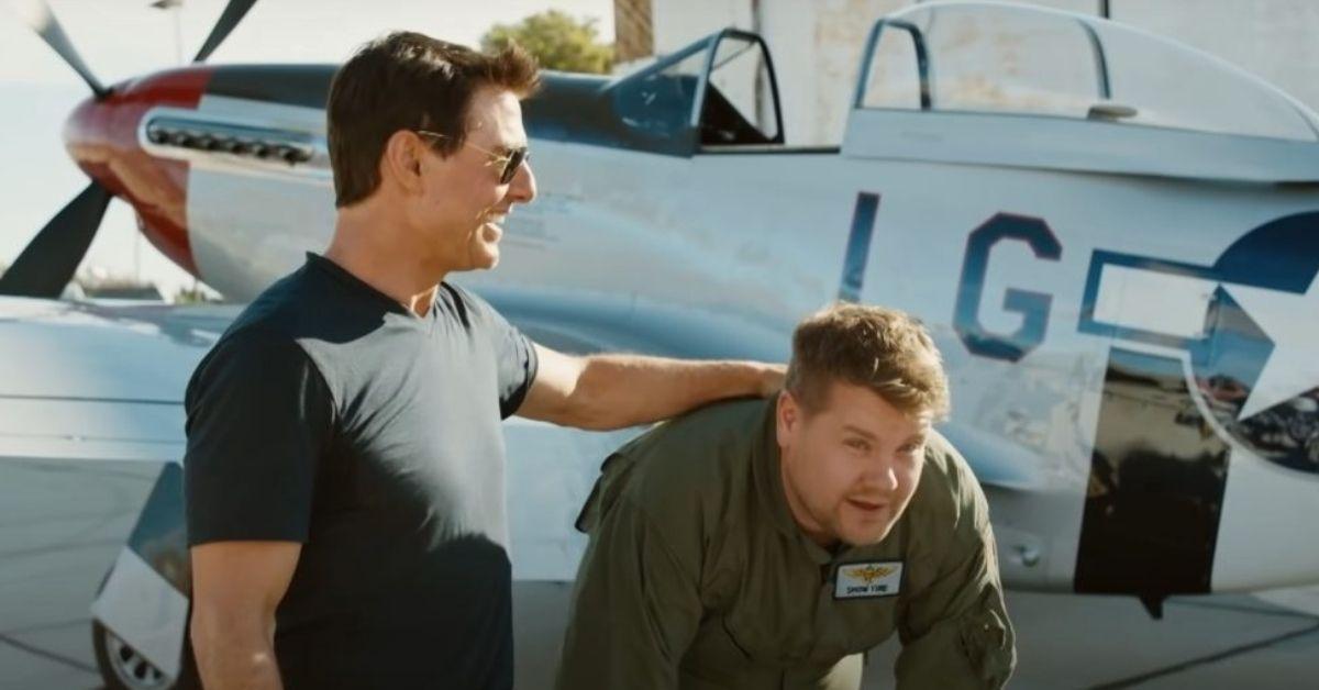 Tom-Cruise Laughing Black T-Shirt Black Sunglasses Hand On Nervous James-Corden- Green Army Uniforme-WWII-Fighter-Aircraft